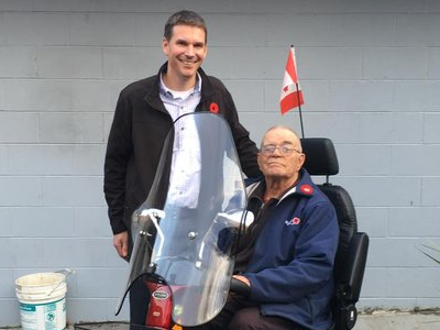 Chris Kehler presents Bert Wiebe with Scooter